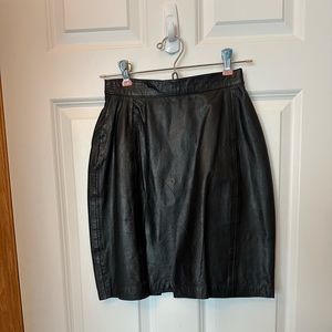 Black leather mini skirt with full zip up the back. Size 9/10